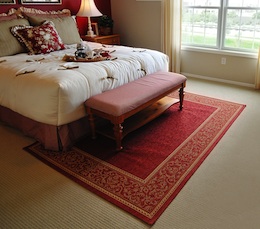 traditional bedroom with red rug