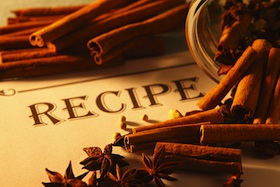 recipe card with cinnamon sticks