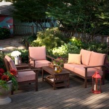 wood patio set with thick colorful cushions